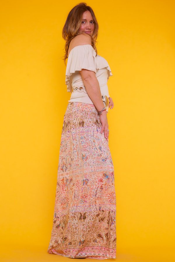 Blusa de algodón con escote en forma de barco sin mangas. Ajustada al cuerpo ideal para usar con vaqueros y demás prendas al gusto.