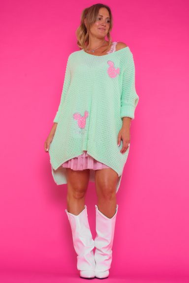 Jersey Merlina: jersey elástico con cuello amplio, corte asimétrico y detalles dorados con siluetas de Mickey Mouse. Ligero, moderno y perfecto para un look con estilo.