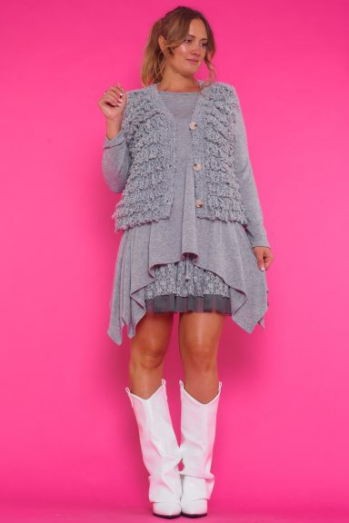 Chaleco elástico con escote en pico, cierre de botones y tejido ultra suave. Cómodo, elegante y versátil para cualquier ocasión.