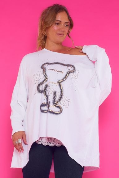 Sudadera Brenda: sudadera elástica con cuello amplio y detalles dorados brillantes en la parte frontal. Cómoda y sofisticada, ideal para cualquier ocasión.