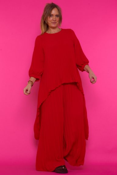 Descubre el conjunto plisado Waffle, ideal para la mujer boho-chic. Comodidad y estilo se unen en este diseño versátil que realza tu figura. ¡Perfecto para cualquier ocasión!