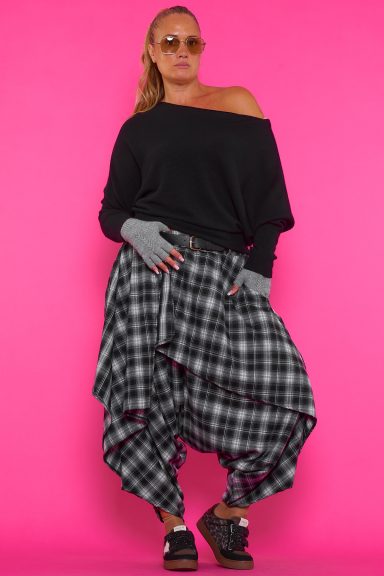 Descubre el pantalón Sidiru de cuadros con diseño asimétrico. Estilo boho-chic único y máxima comodidad para tu día a día. ¡Añade originalidad a tus looks!